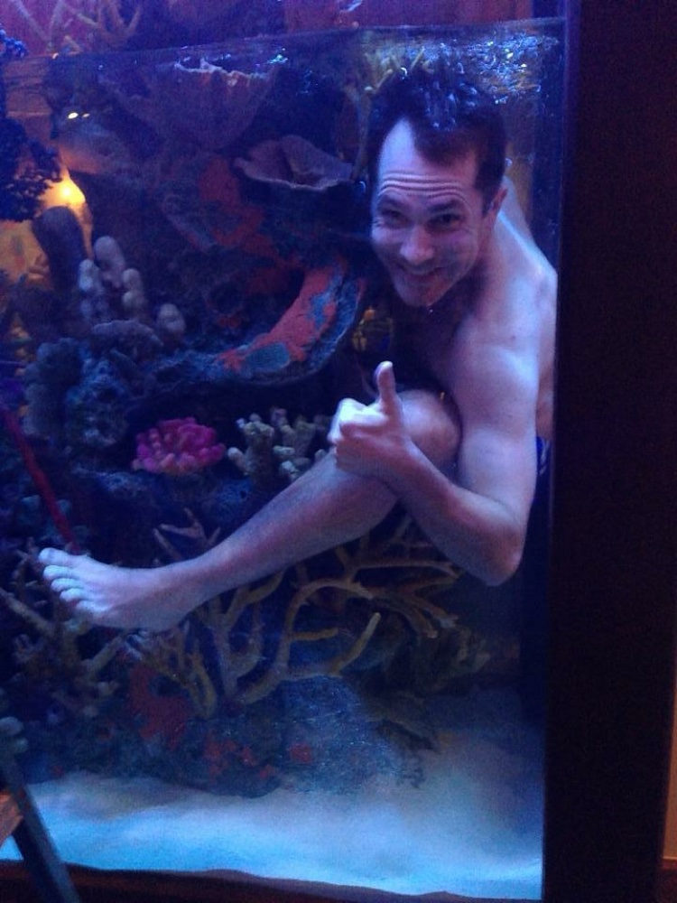 Ben Wehr at work servicing an aquarium